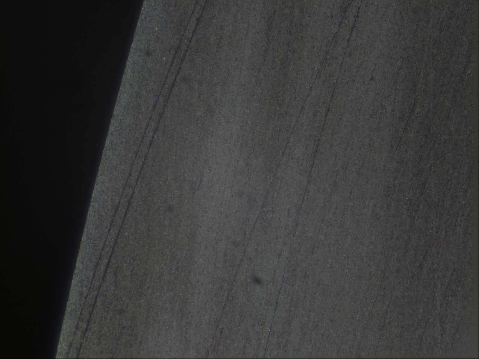 Surface polished to 2.5 microns but scratched